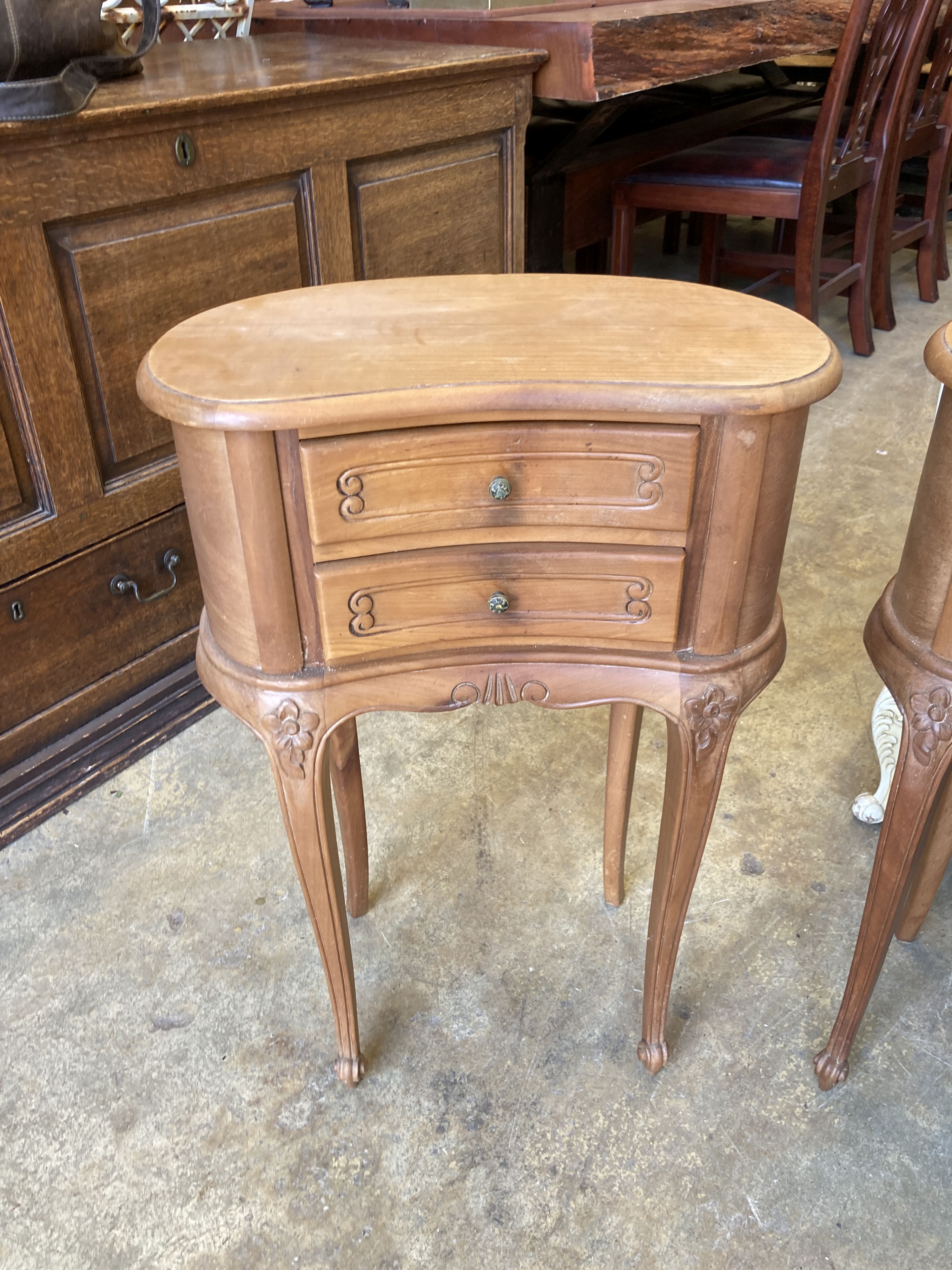 A pair of Louis XVI design walnut kidney-shaped bedside chests, width 45cm, depth 26cm, height 66cm